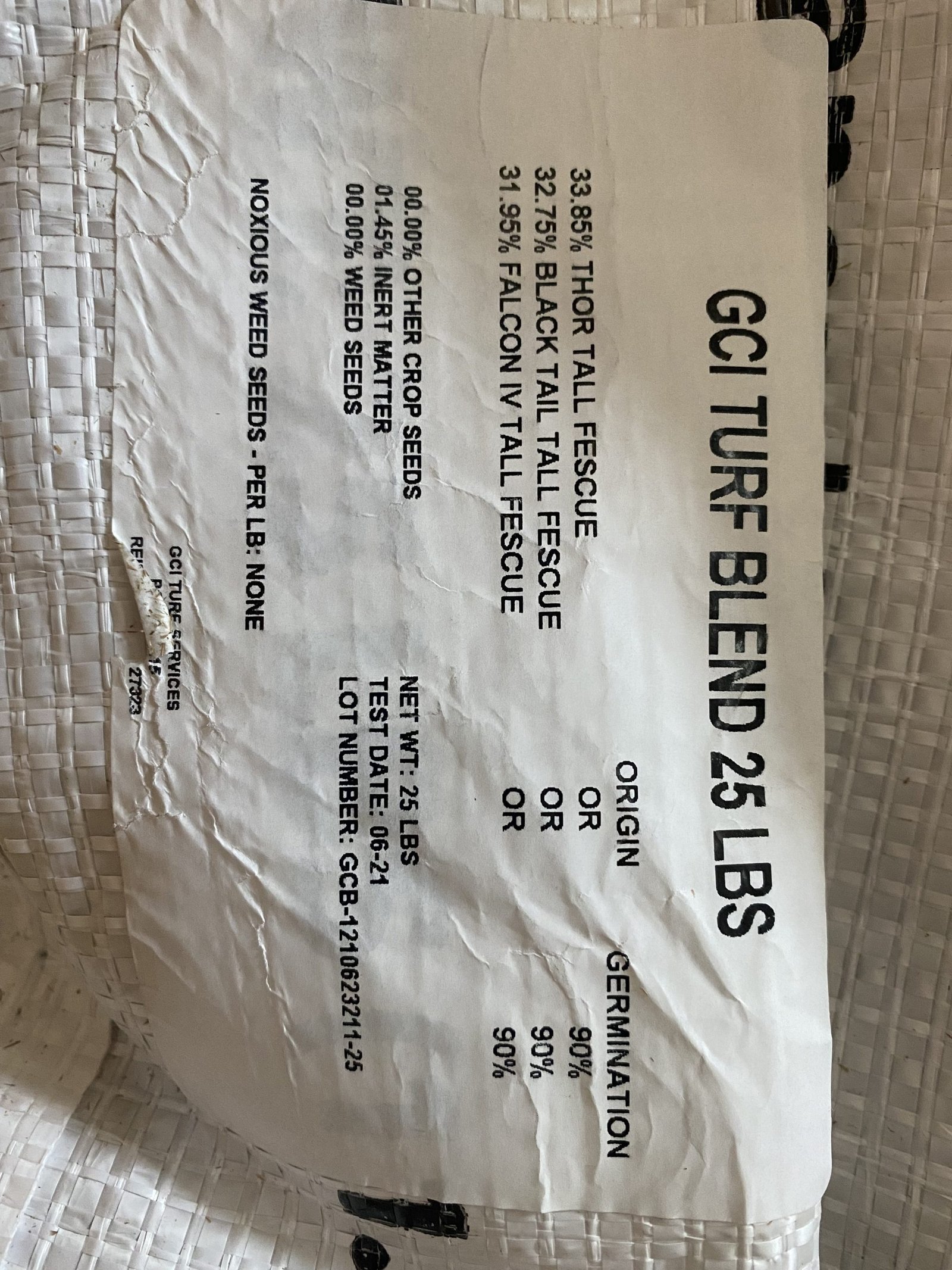 GCI turf-type tall fescue grass seed bag label showing cultivars, purity and germination