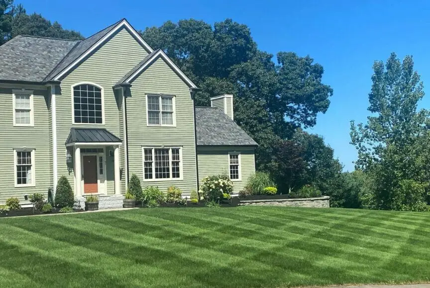 lawn phix customer with thick healthy turf with stripes