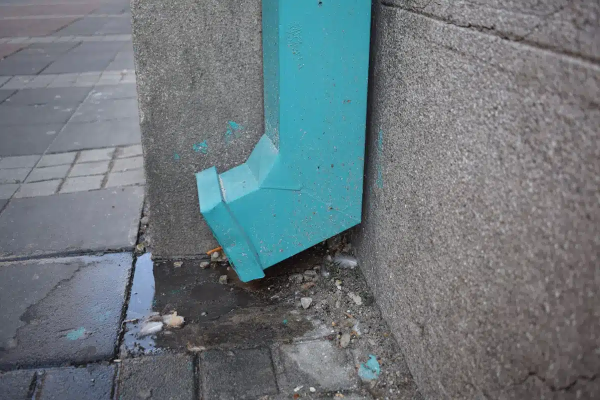 Downspout discharging at ground level