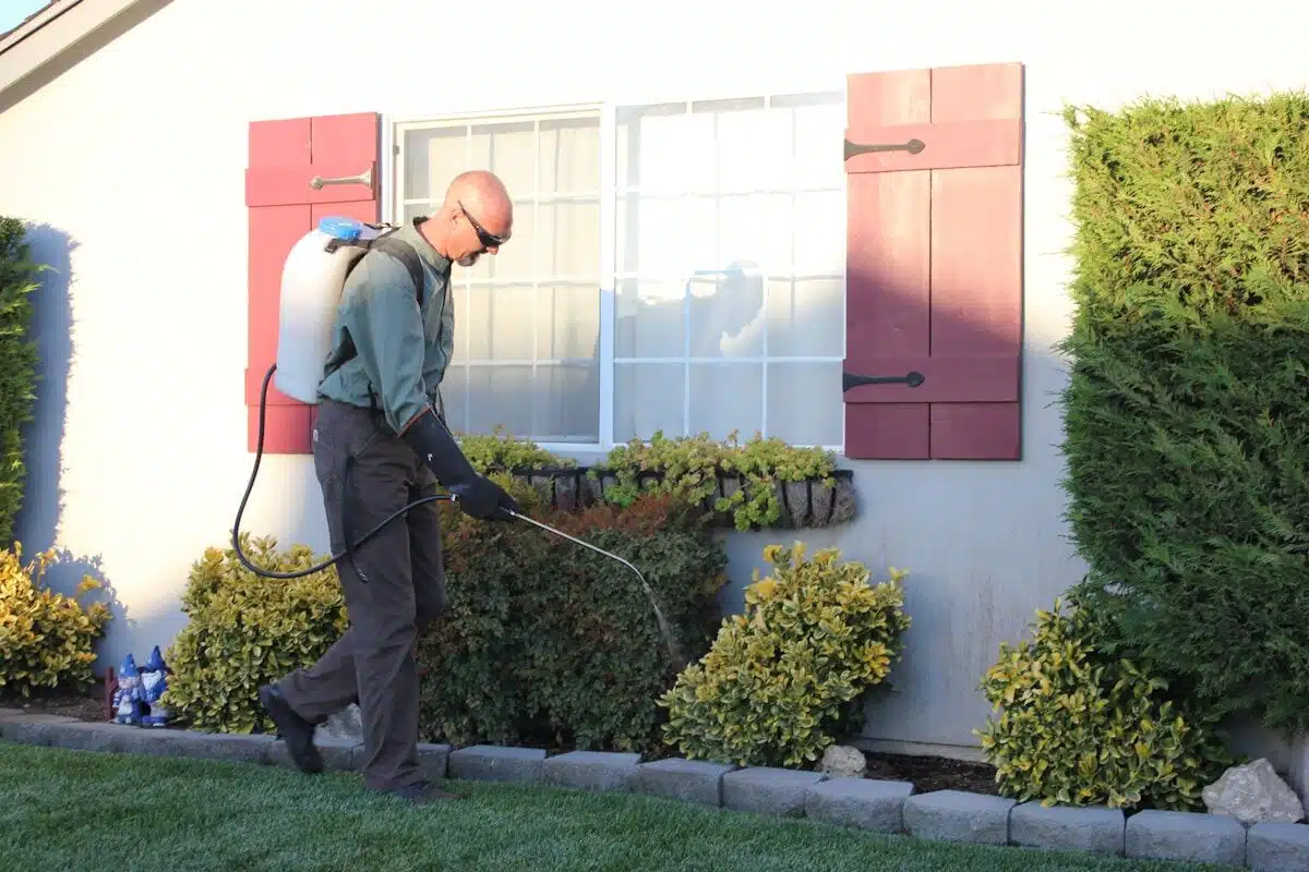 Technician servicing a commercial exterior