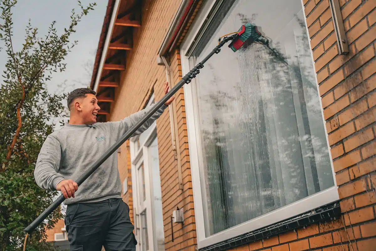Cleaning gutters from the ground with a pole