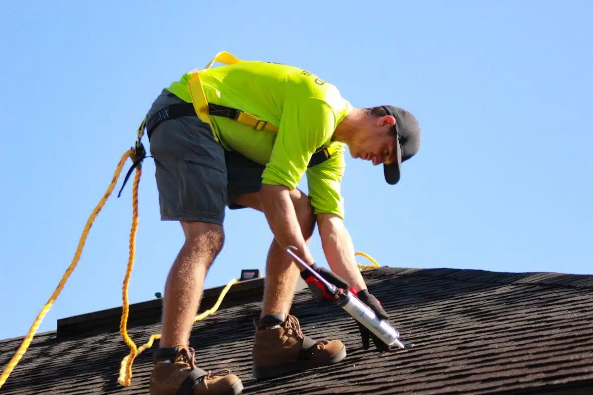 Gutter technician working at a roofline